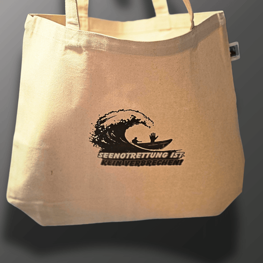 Seenotrettung ist kein Verbrechen Tragetasche. 70% des Erlöses spenden wir an Seawatch. - SoliWear